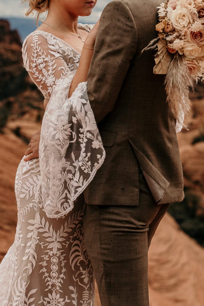 Closeup of a bride's boho lacy sleeve.