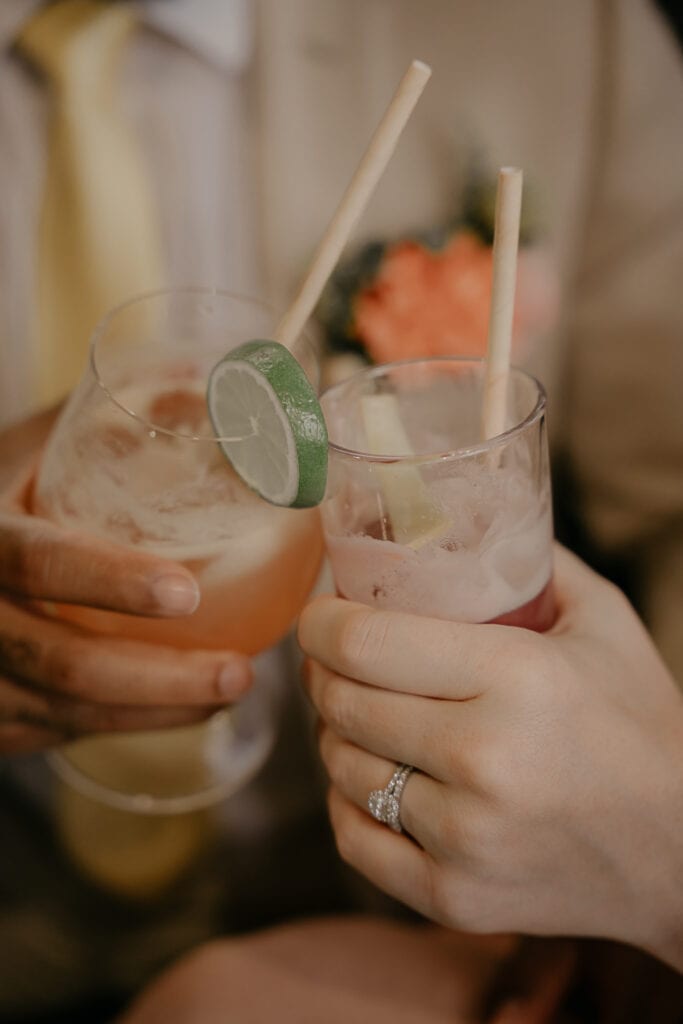 Newly eloped couple cheers with their Corsair Distillery cocktails during their all day elopement.