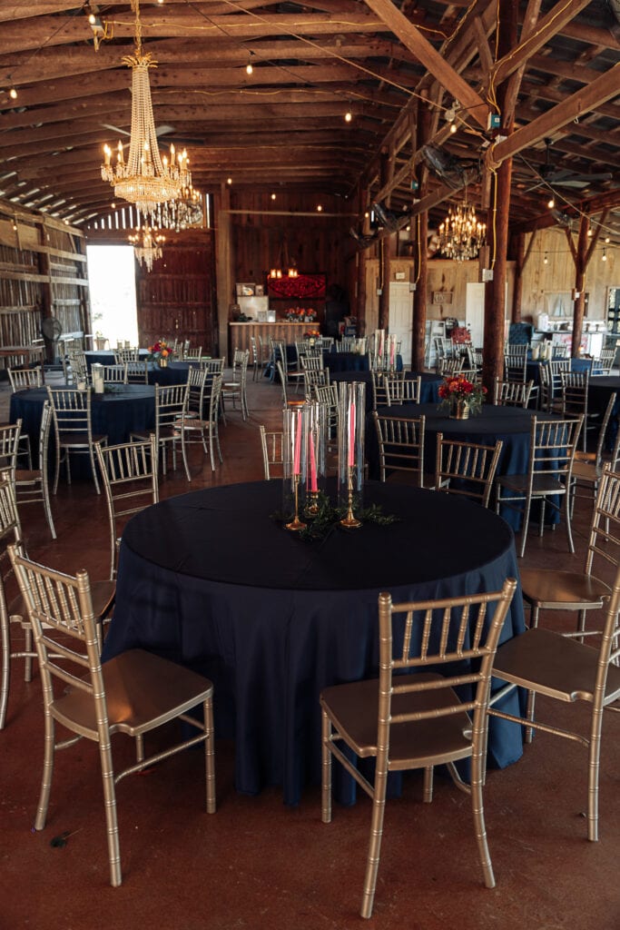 A decorated rustic barn before the wedding reception begins.