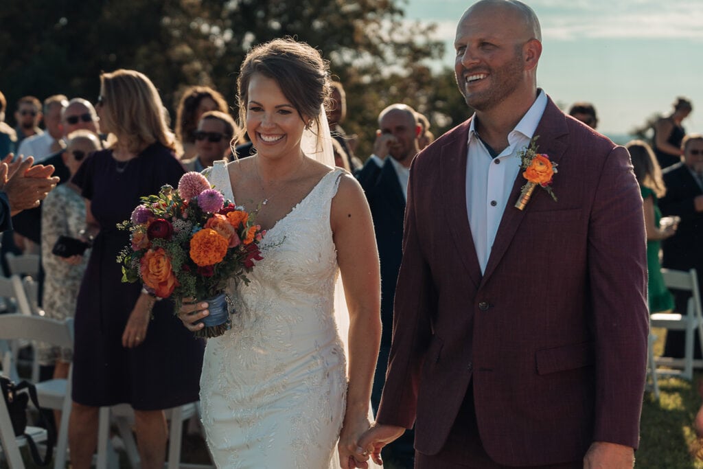Lauren & AJ walk down the aisle after they're announced husband and wife.