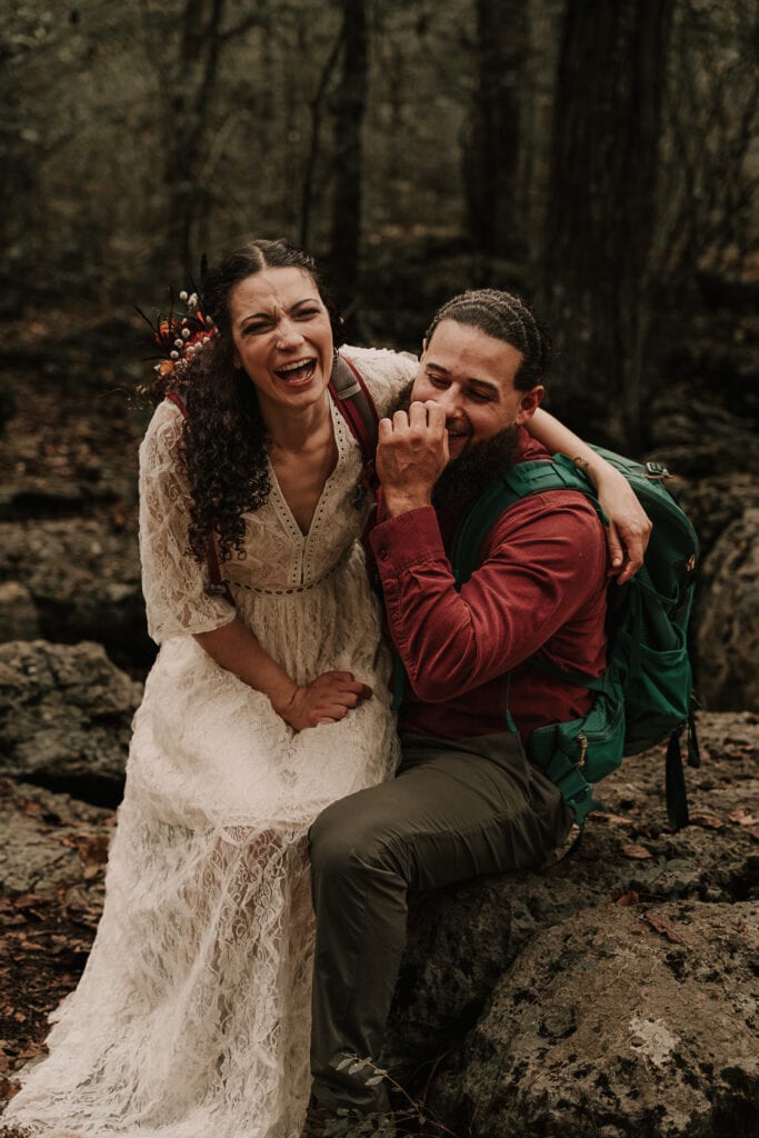 Bride & Groom laugh hysterically during their hiking elopement.