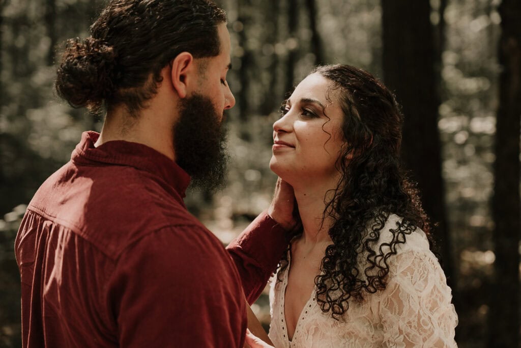 Couple looks at each other during their outdoor elopement ceremony.