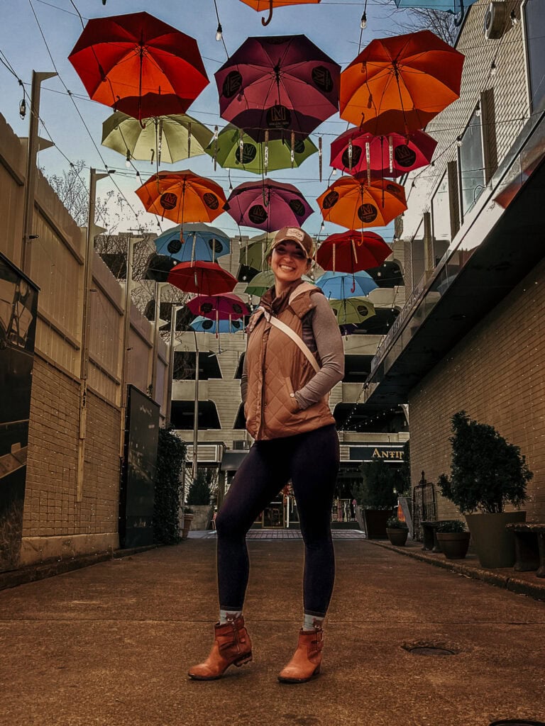 Korey stands under umbrellas in downtown Chattanooga.