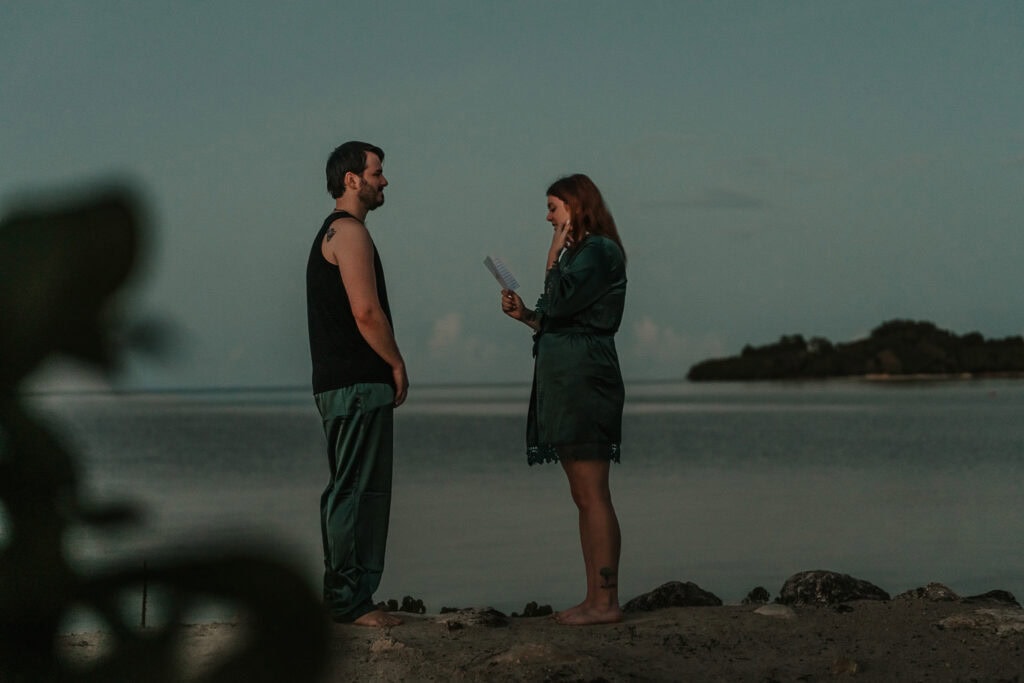 Marissa and David exchange private vows at sunrise while wearing matching pjs.