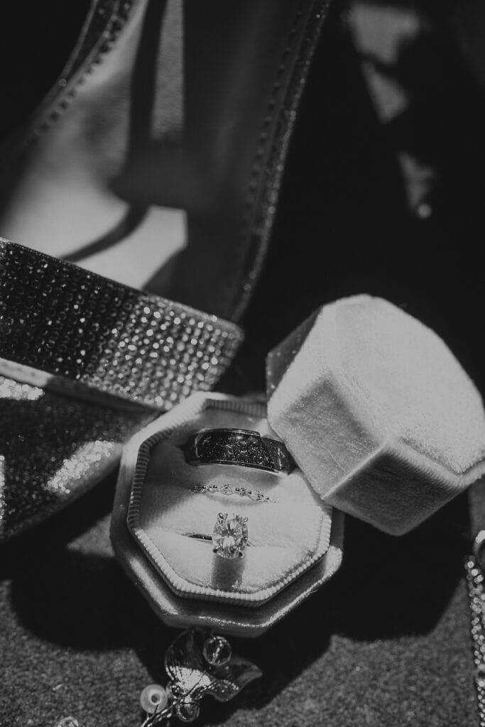 A closeup of wedding rings in a velvet box.