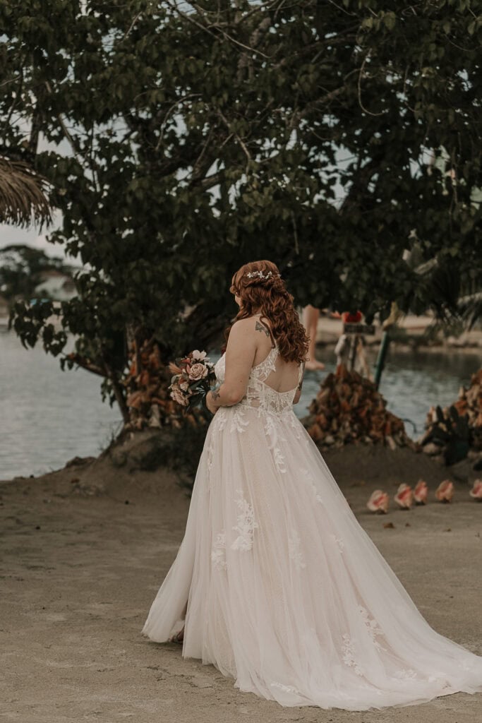 Marissa walks down the beach during the wedding ceremony.