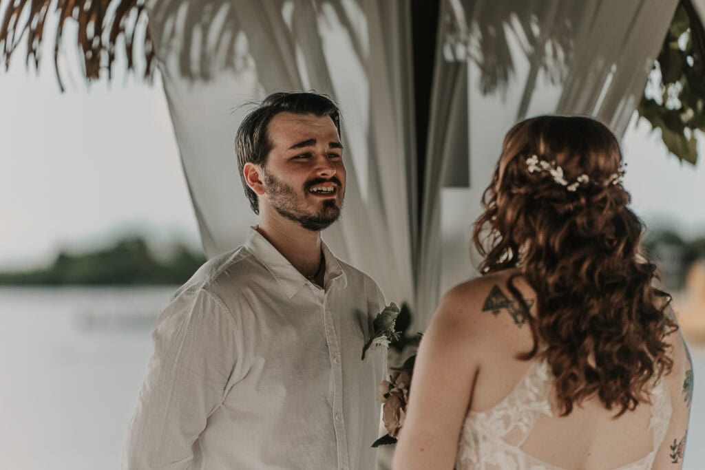 The groom gets emotional during the wedding ceremony.