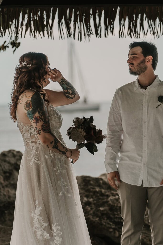 Marissa wipes away a tear during hers and David's wedding ceremony.