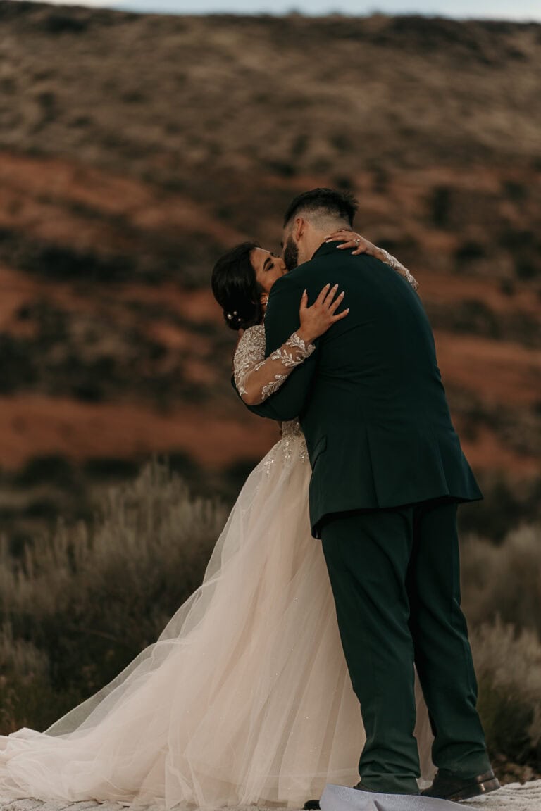 Bride and groom passionately kiss after being pronounced husband and wife.