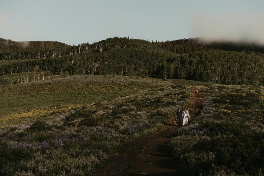 Marissa & Janiel walk a popular trail in Crested Butte, admiring the wildflowers.