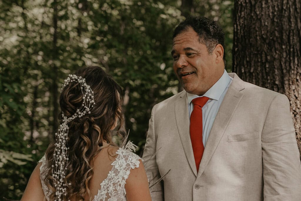 John gets emotional looking at Anita during their wedding day first look.