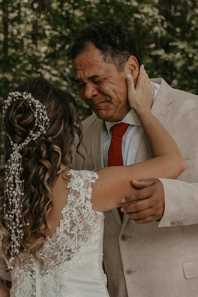 Groom is overcome with emotion, looking at his bride for the first time as they share a first look on their wedding day.