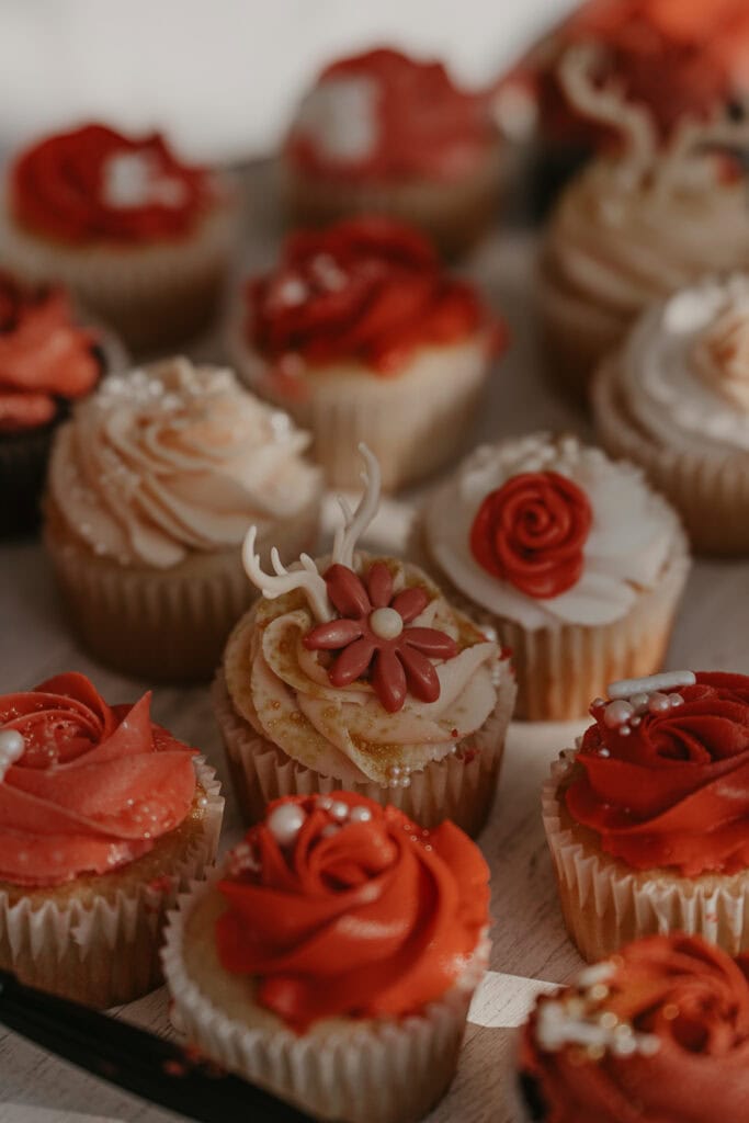 Cupcakes decorated with mini edible antlers and flowers.