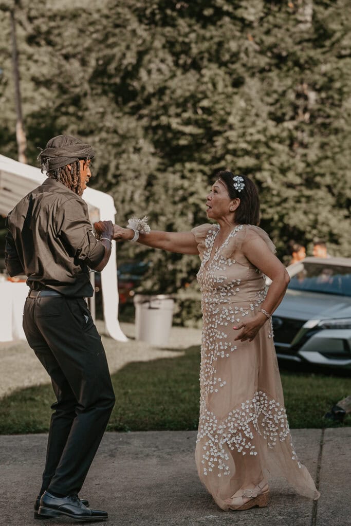 Two people dance together during John and Anita's wedding reception.