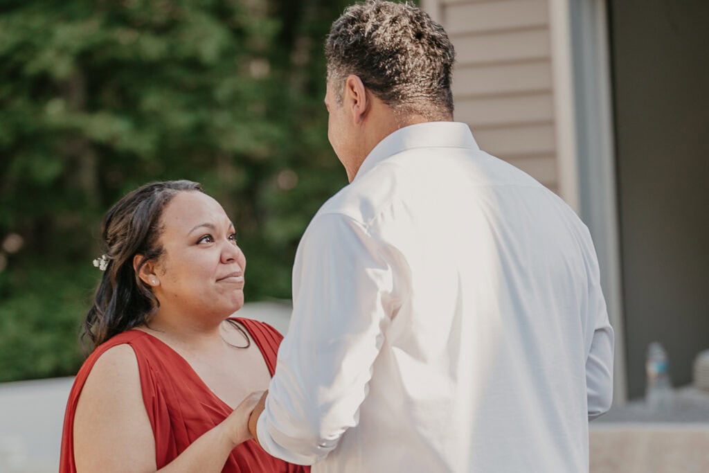 The groom's daughter gets emotional during their dance together at his reception.