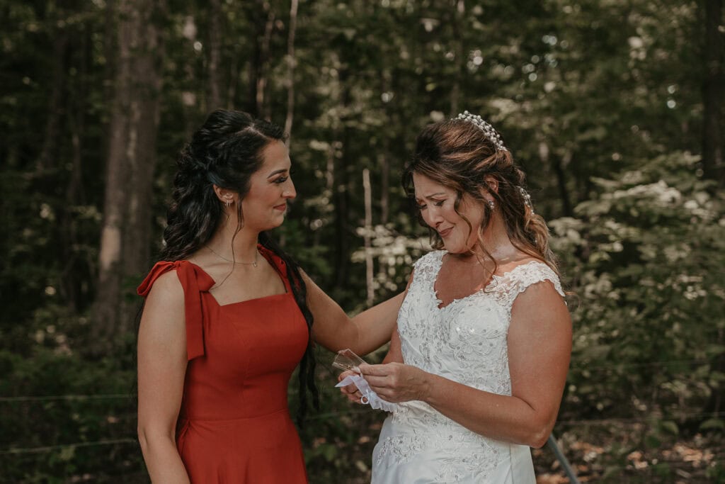 Mom and daughter get emotional as the daughter gives her mom a gift on her wedding day.