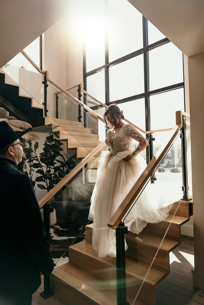 Amaris walks down the stairs so her dad can see her in her wedding dress for the first time.