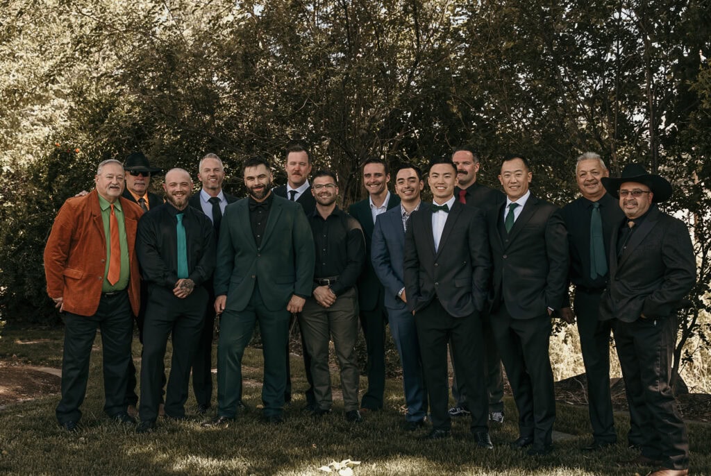 A group of family and friends pose with Kyle on his wedding day.