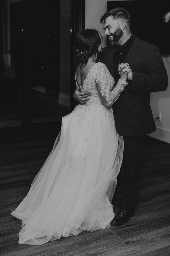 Bride and groom dance together at their wedding reception.